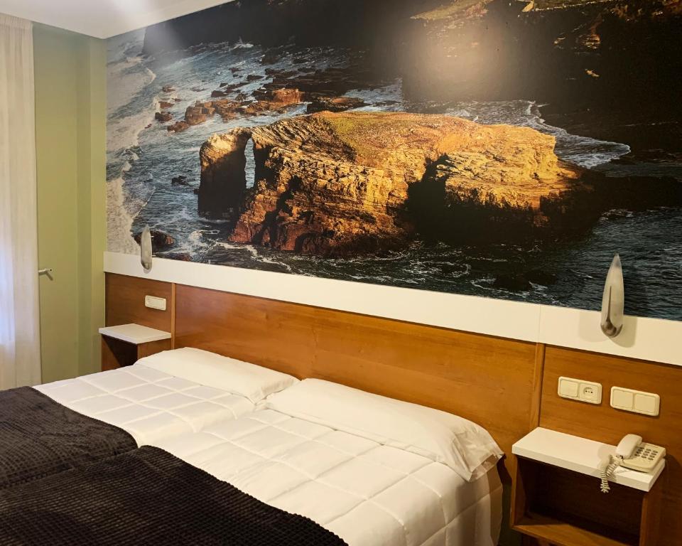 Postel nebo postele na pokoji v ubytování Hotel Bello