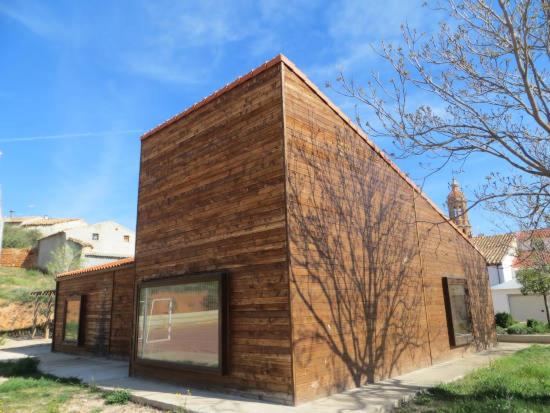 a small brick building on the side of a street at Blesamemucho - Casa Rural Situada en BLESA 