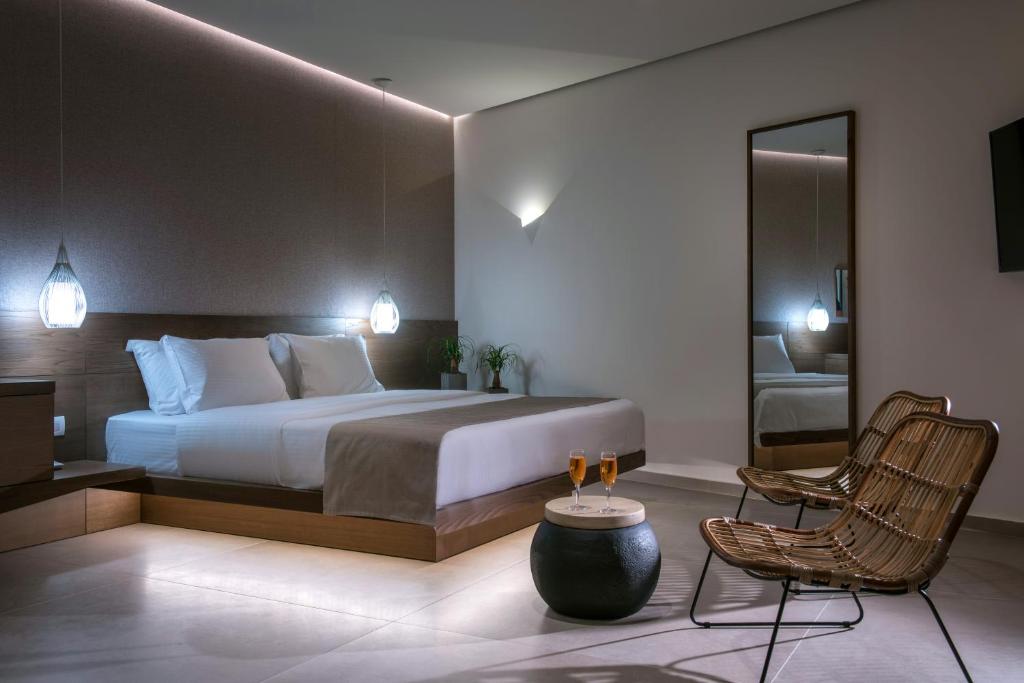 Postel nebo postele na pokoji v ubytování Metropole Urban Hotel