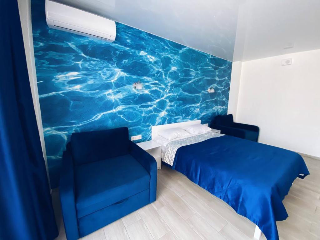 Postel nebo postele na pokoji v ubytování Kovcheg Hotel