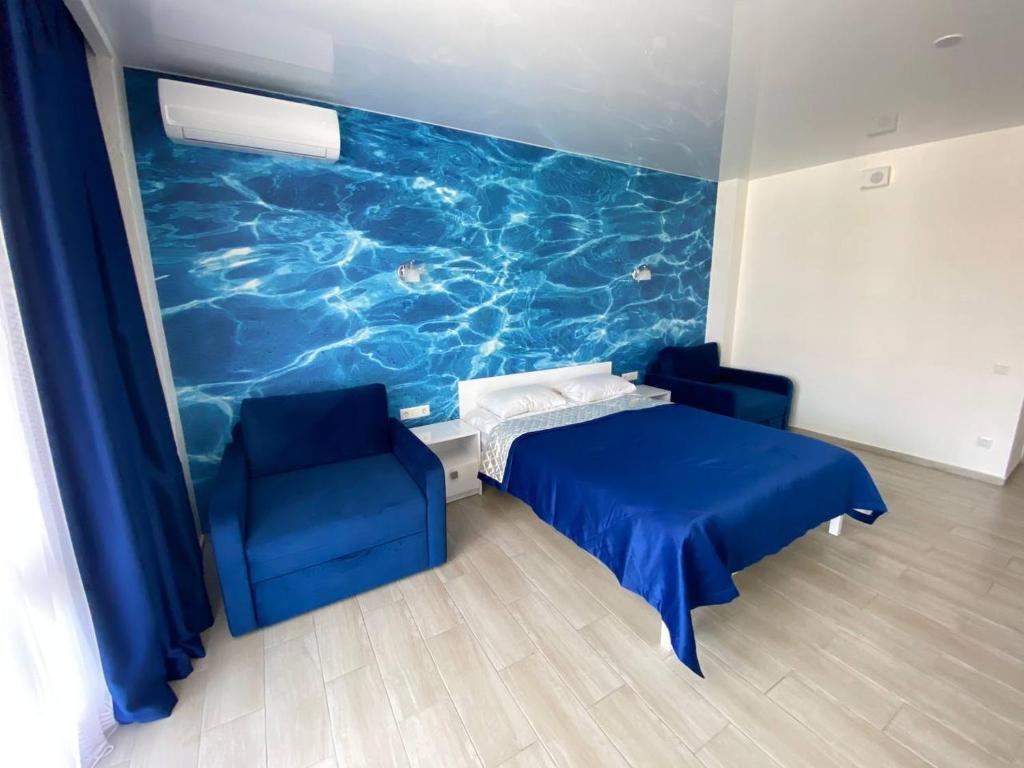 Postel nebo postele na pokoji v ubytování Kovcheg Hotel