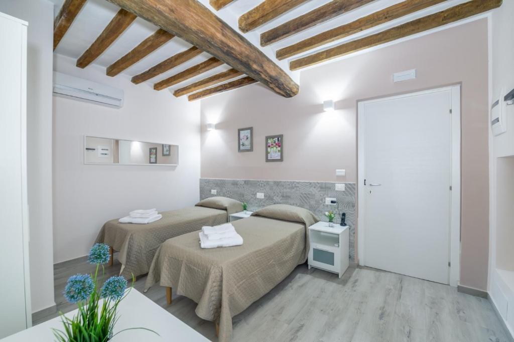 Postelja oz. postelje v sobi nastanitve Residenza Borgo Guazzo