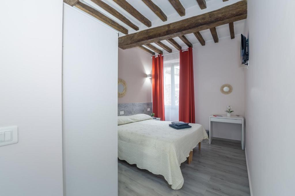 Postel nebo postele na pokoji v ubytování Residenza Borgo Guazzo