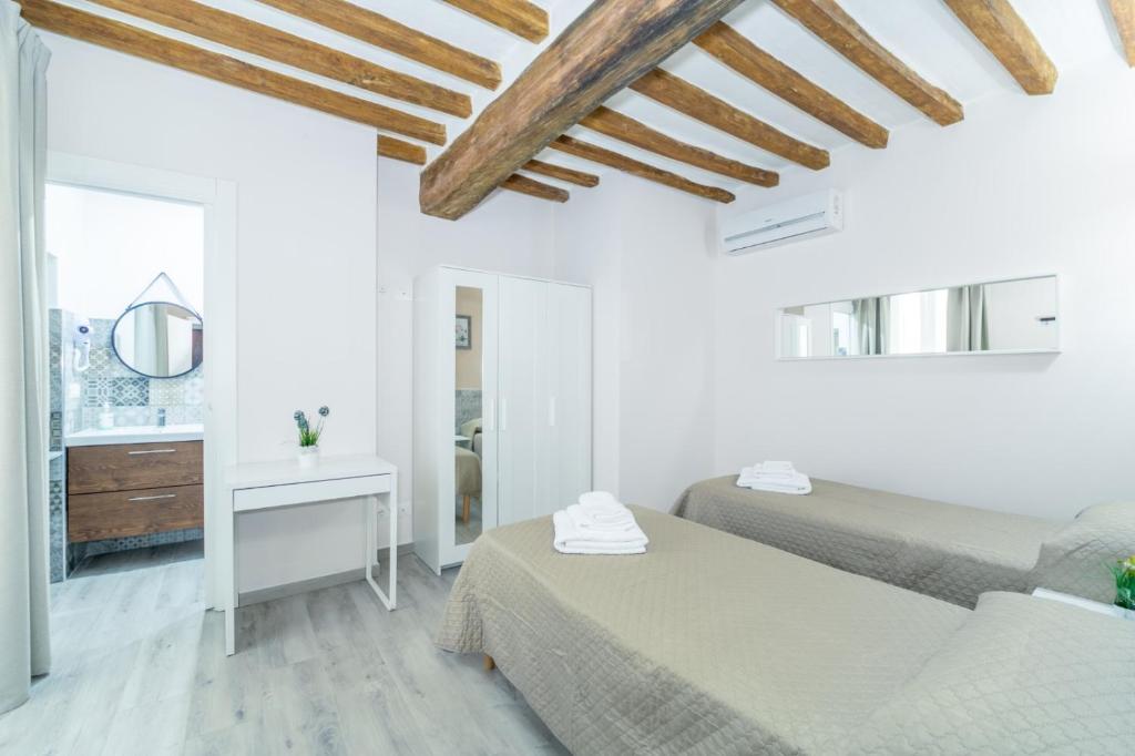 Postel nebo postele na pokoji v ubytování Residenza Borgo Guazzo