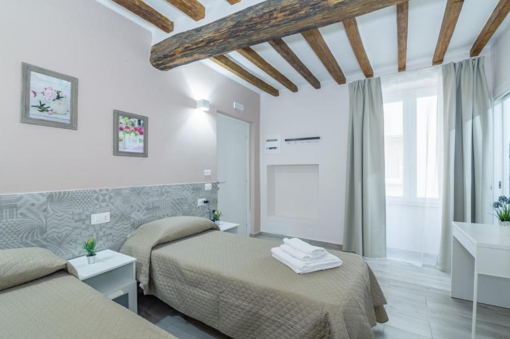 Postel nebo postele na pokoji v ubytování Residenza Borgo Guazzo