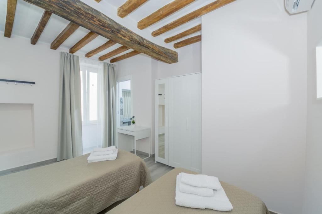 Postel nebo postele na pokoji v ubytování Residenza Borgo Guazzo