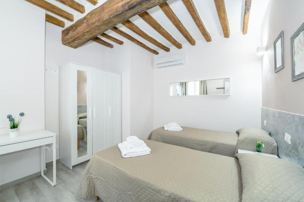Postel nebo postele na pokoji v ubytování Residenza Borgo Guazzo