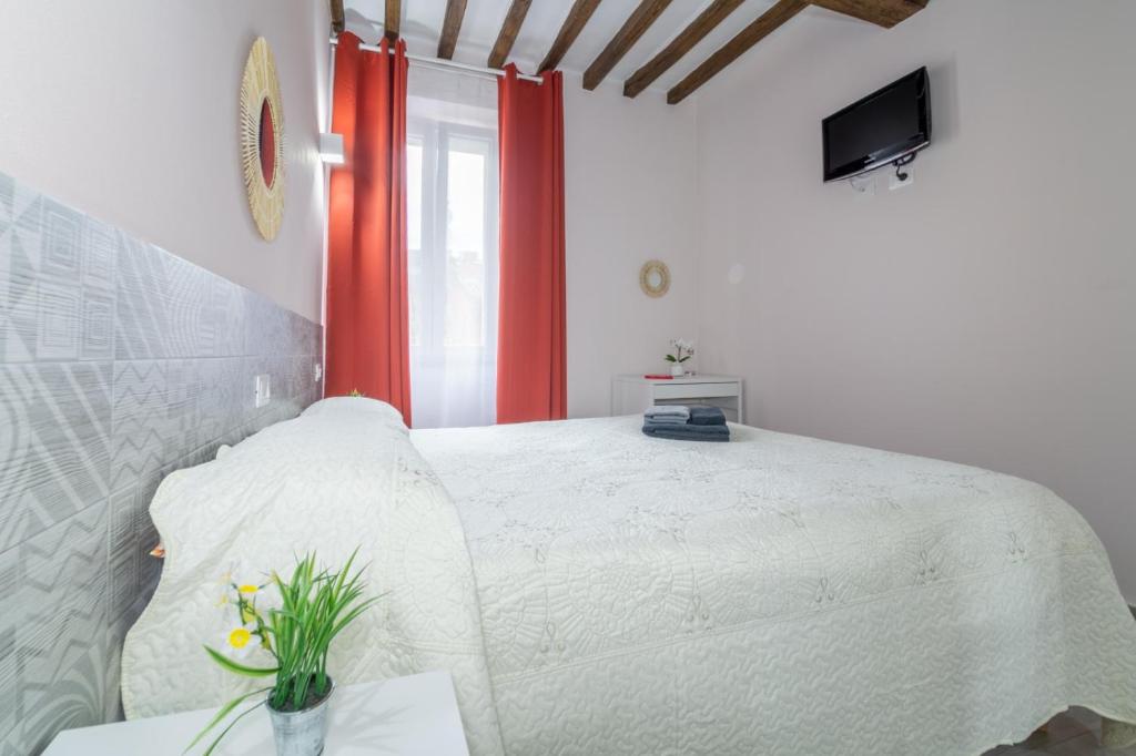 Postel nebo postele na pokoji v ubytování Residenza Borgo Guazzo