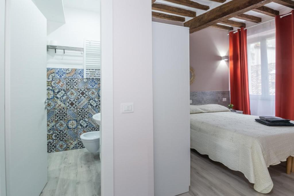 Postel nebo postele na pokoji v ubytování Residenza Borgo Guazzo