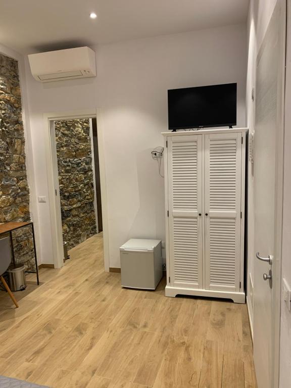 TV a/nebo společenská místnost v ubytování A Ca' De Mananan Guesthouse