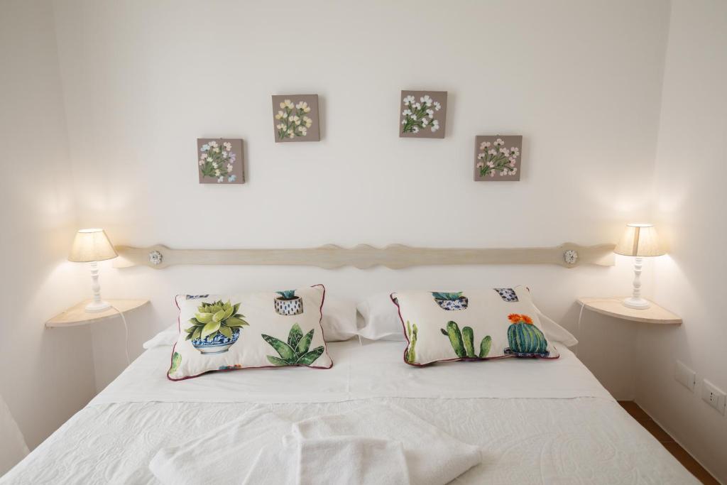 Rúm í herbergi á Relais Trulli Le Icone