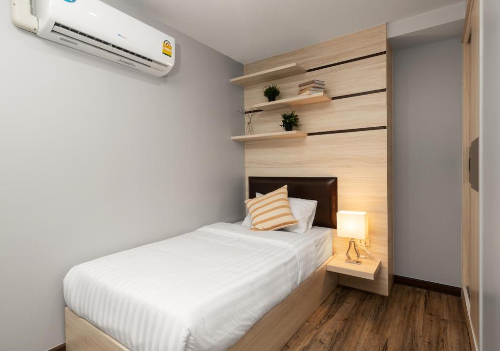 Postel nebo postele na pokoji v ubytování VSK RESIDENCE - SHA Extra Plus