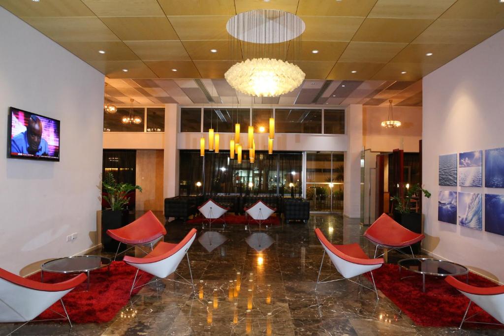 a lobby with chairs and a couch and a chandelier at Altius Boutique Hotel in Nicosia