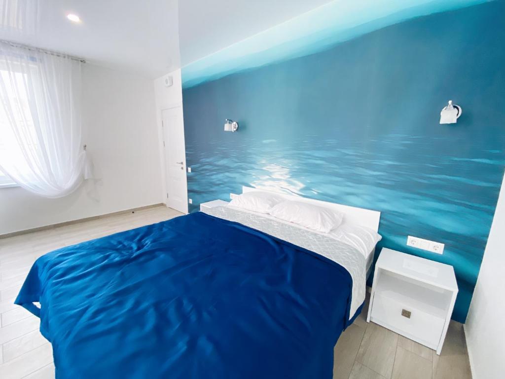 Postel nebo postele na pokoji v ubytování Kovcheg Hotel