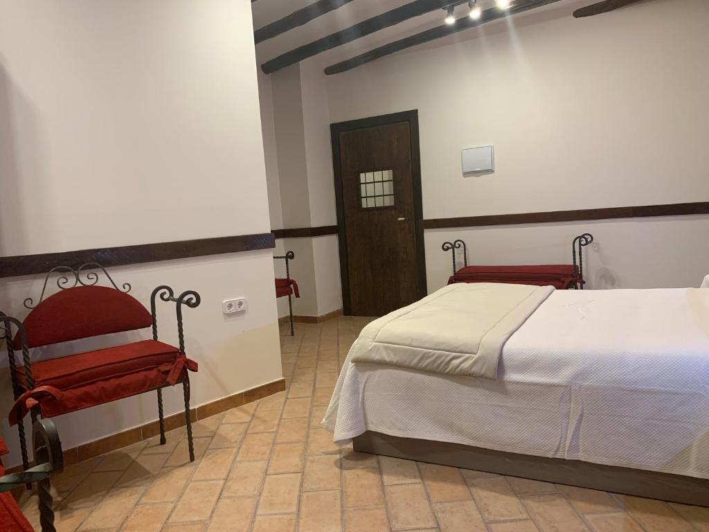 Postel nebo postele na pokoji v ubytování Hostal Poeta Machado