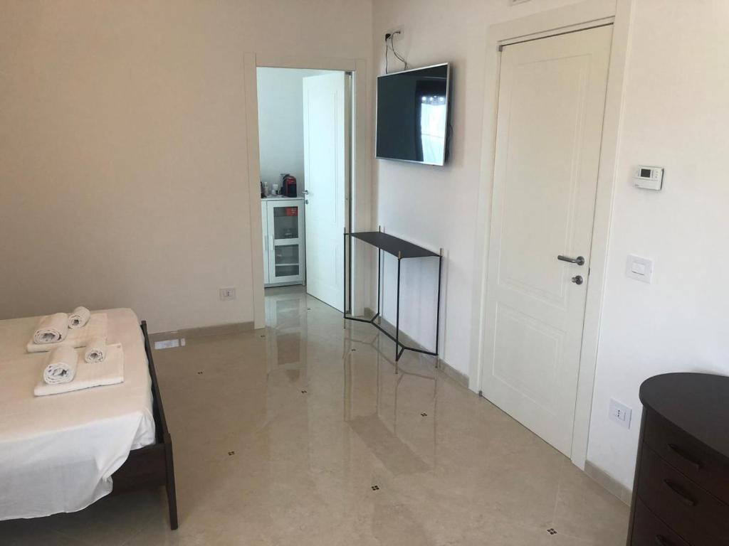 Televízia a/alebo spoločenská miestnosť v ubytovaní Villa Carmen Resort