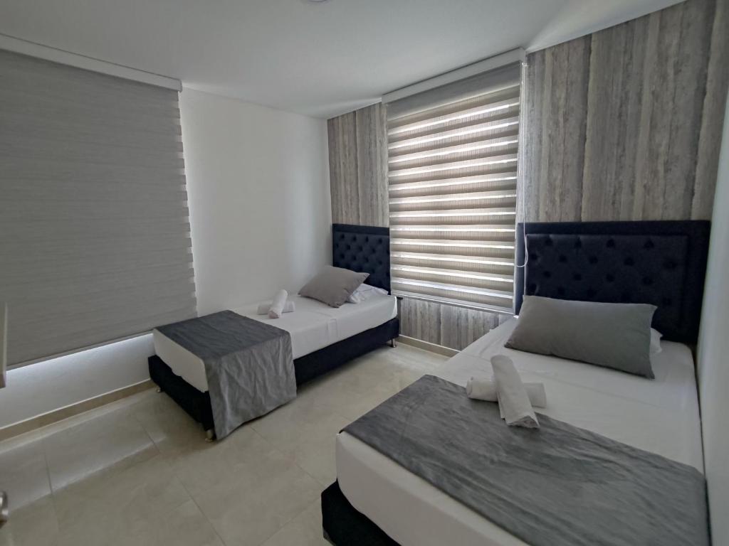 Postel nebo postele na pokoji v ubytování Hotel Aguas Abiertas