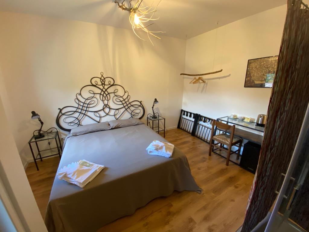Postel nebo postele na pokoji v ubytování Albergo Wellness Da Febo