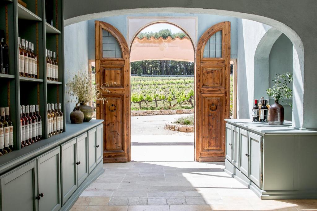 an entrance to a wine cellar with an open door at Domaine Rabiega - Vineyard and Boutique hotel in Draguignan