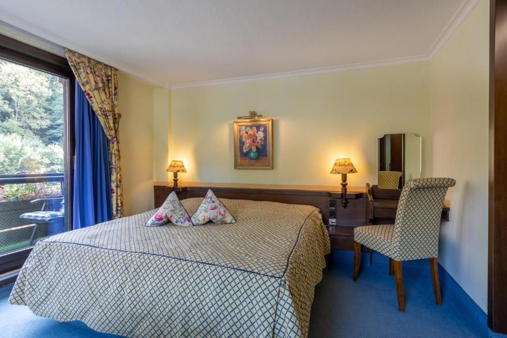 Postel nebo postele na pokoji v ubytování Sackmann Genuss und Spa Resort