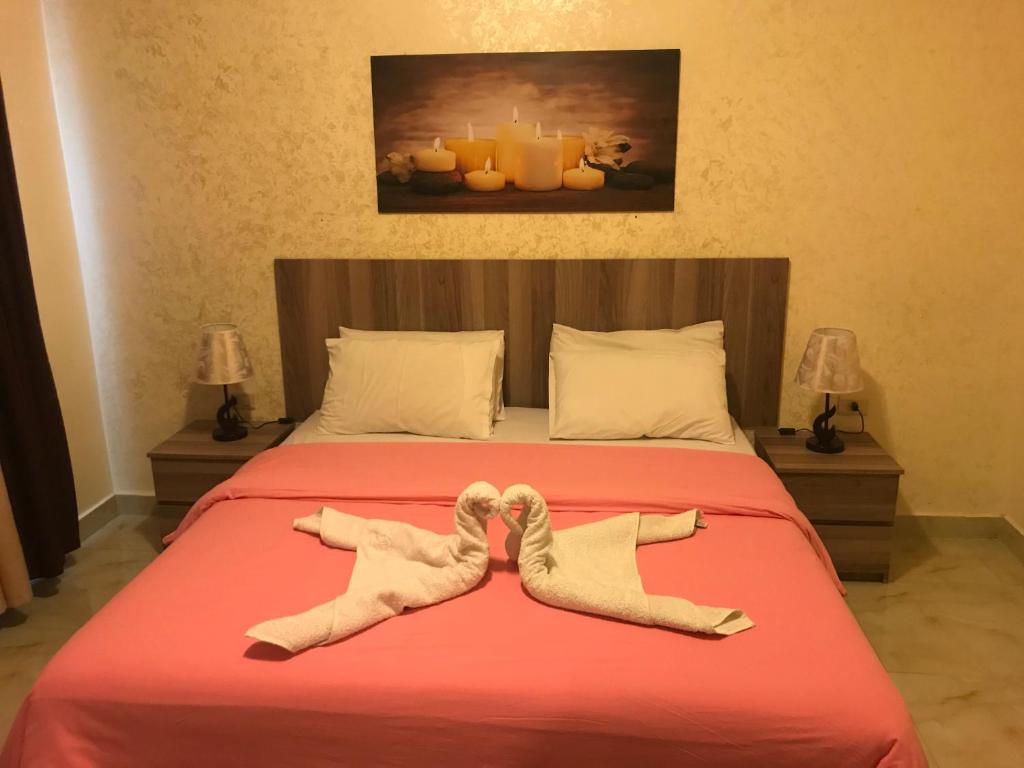 Postel nebo postele na pokoji v ubytování Suzan Hotel Apartments