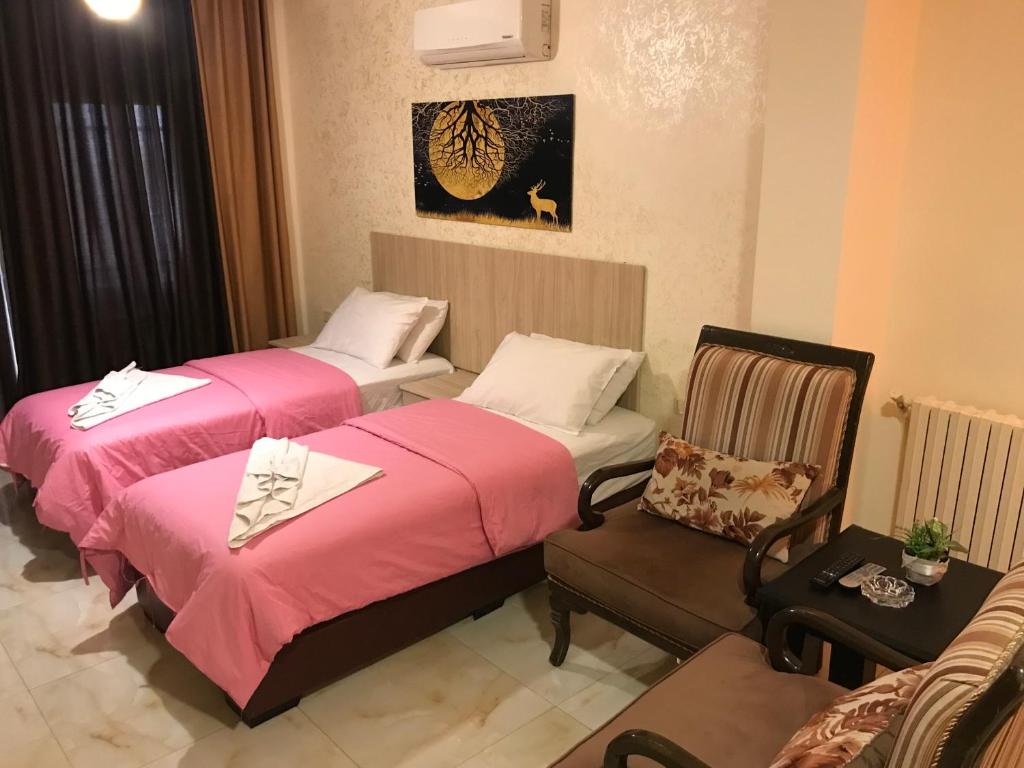 Postel nebo postele na pokoji v ubytování Suzan Hotel Apartments
