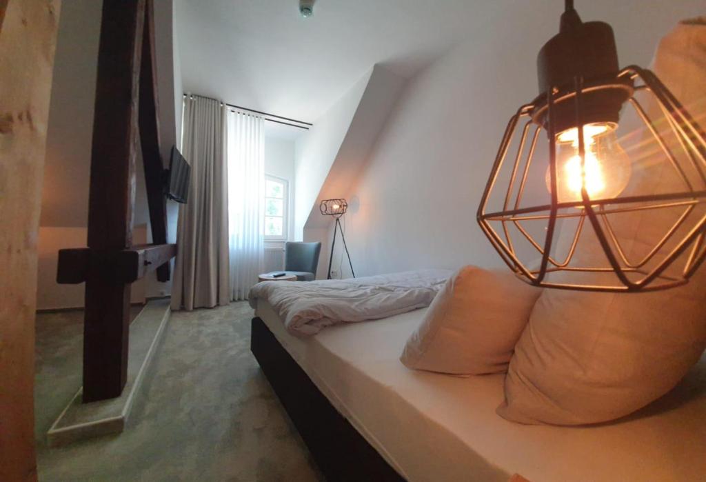 Postel nebo postele na pokoji v ubytování Hotel Le Filou