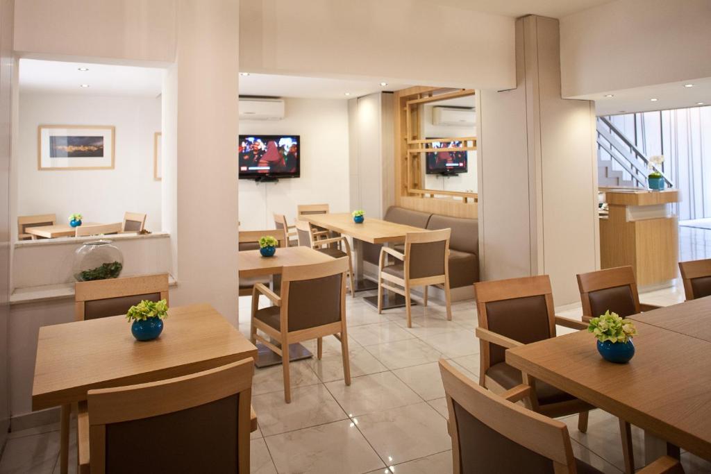 TV a/nebo společenská místnost v ubytování Hotel Hermes