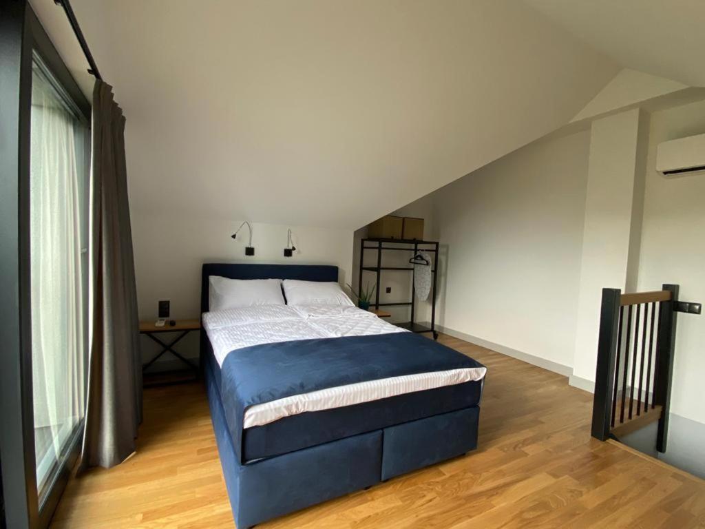 Postel nebo postele na pokoji v ubytování Manca Loft & SPA