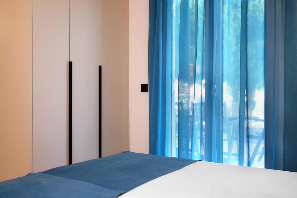 Postel nebo postele na pokoji v ubytování AMMOESSA APARTMENTS