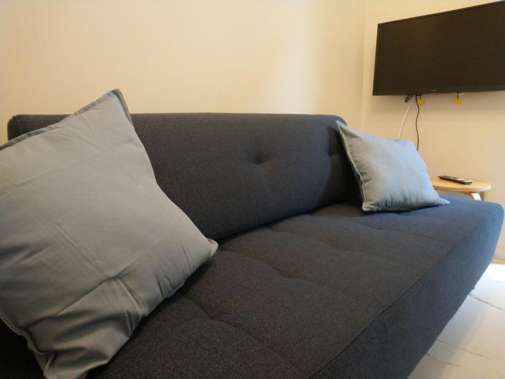Televízia a/alebo spoločenská miestnosť v ubytovaní Nowe Apartamenty na Gryfa