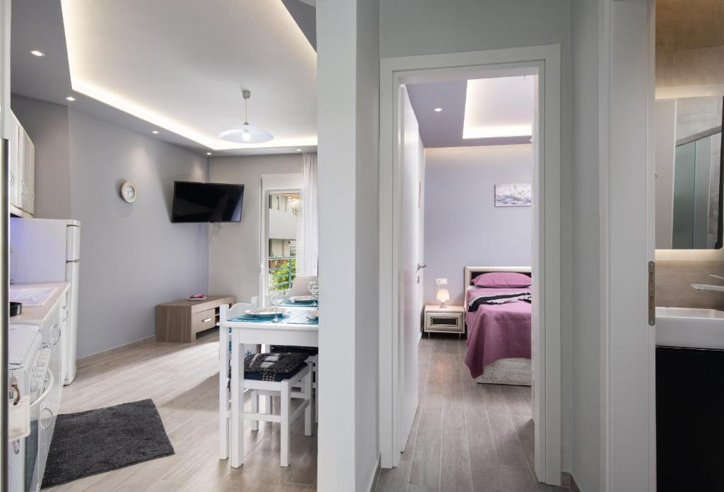 Postel nebo postele na pokoji v ubytování Leonardo Apartamente