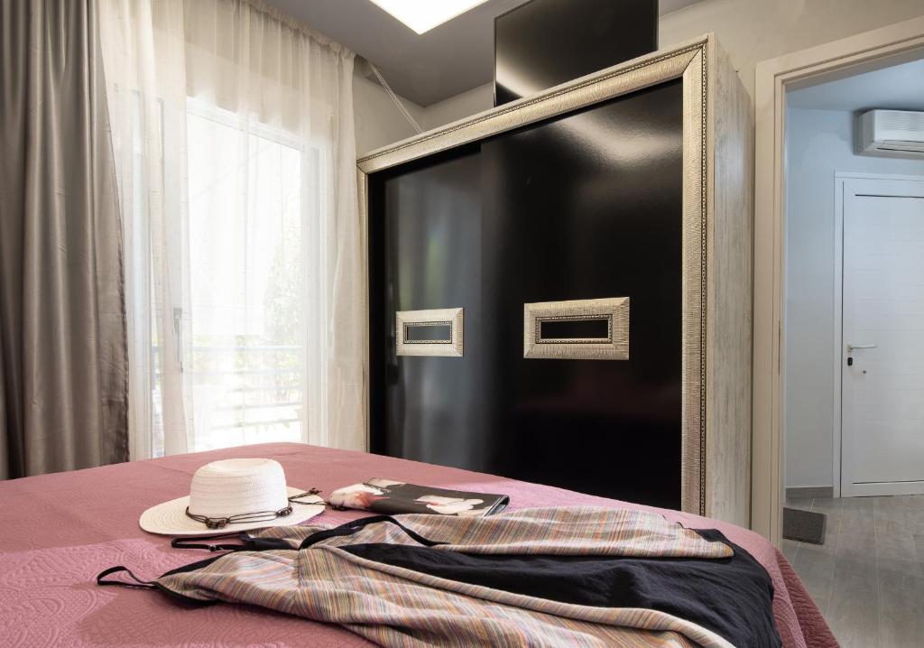 Postel nebo postele na pokoji v ubytování Leonardo Apartamente