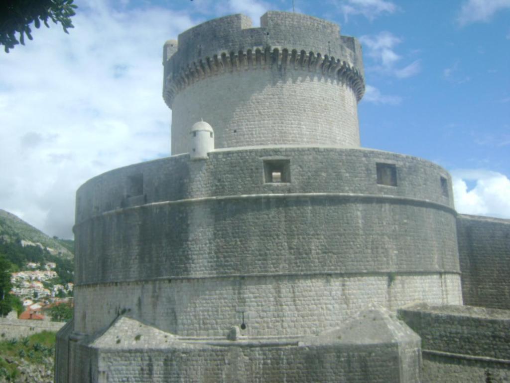 a castle with a tower on top of it at Studio Andrea in Dubrovnik