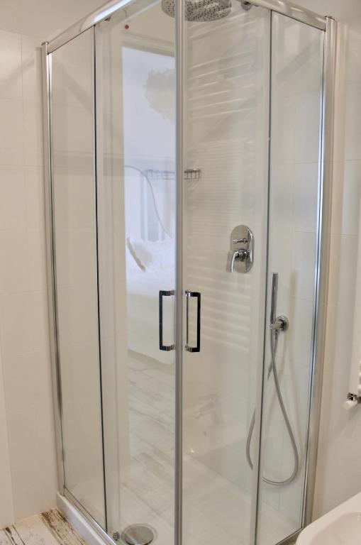 a shower with a glass door in a bathroom at Cetara Costa d'Amalfi Residence in Cetara