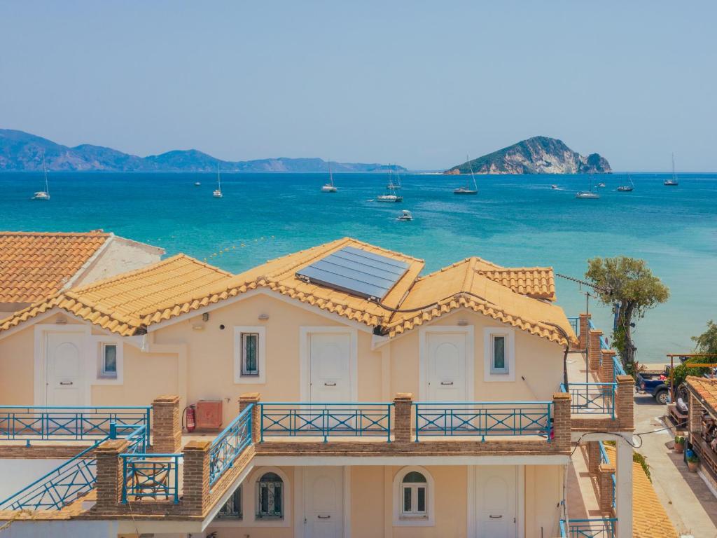 a house with a view of the ocean at SeaSide Apartments in Zakynthos Town