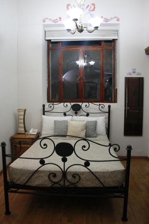 Postel nebo postele na pokoji v ubytování Casa de los Dulces Sueños