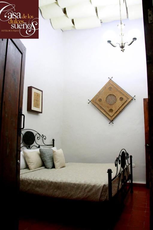 Postel nebo postele na pokoji v ubytování Casa de los Dulces Sueños