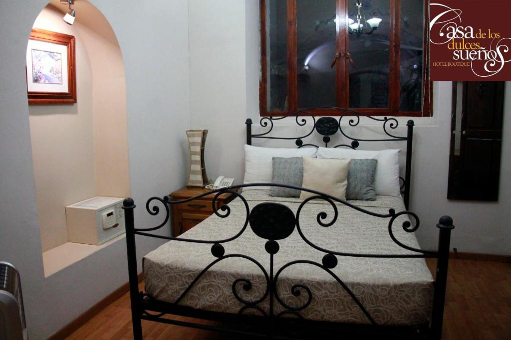 Postel nebo postele na pokoji v ubytování Casa de los Dulces Sueños
