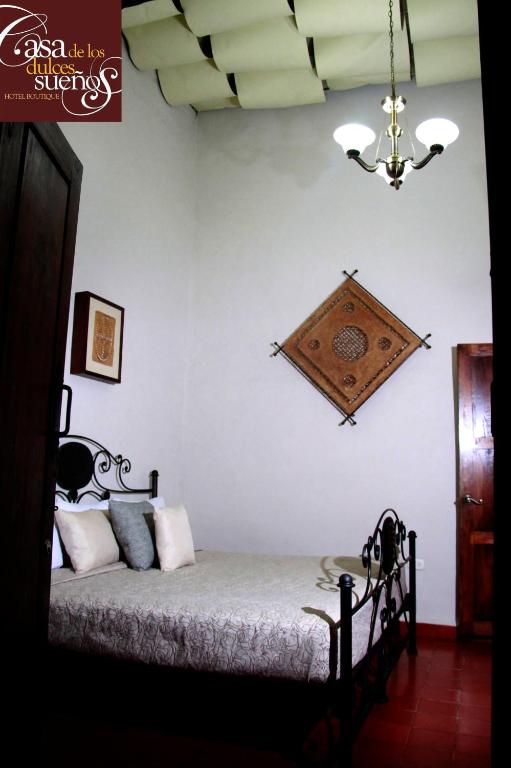 Postel nebo postele na pokoji v ubytování Casa de los Dulces Sueños