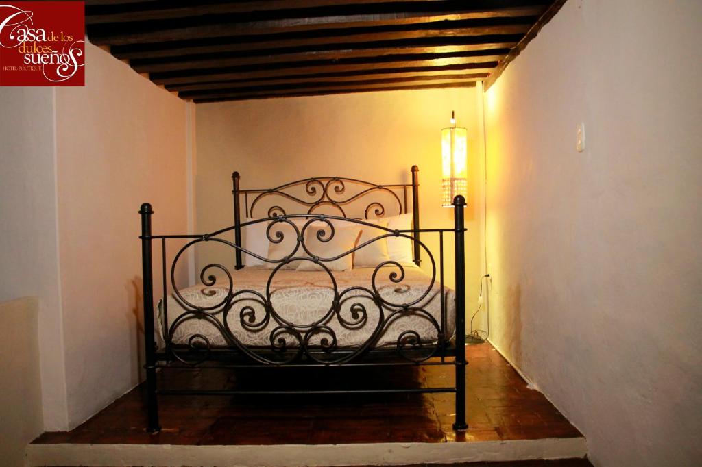 Postel nebo postele na pokoji v ubytování Casa de los Dulces Sueños