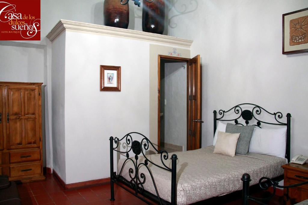 Postel nebo postele na pokoji v ubytování Casa de los Dulces Sueños