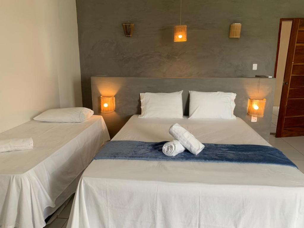 Postel nebo postele na pokoji v ubytování Hotel Fazenda Monte Cristo