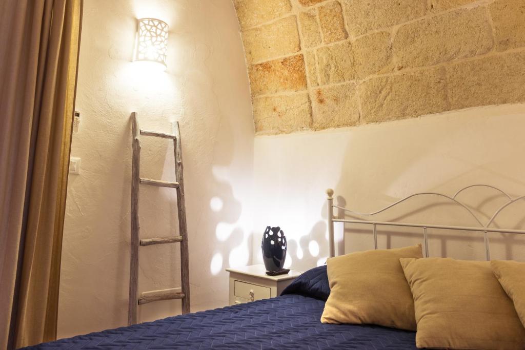 Łóżko lub łóżka w pokoju w obiekcie B&B Nel Blu Dipinto Di Blu