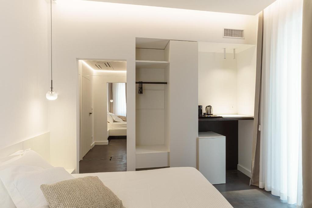 Łóżko lub łóżka w pokoju w obiekcie B&B Nel Blu Dipinto Di Blu