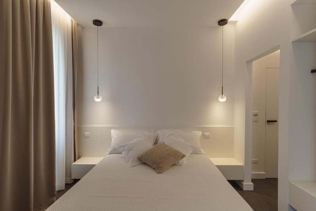 Łóżko lub łóżka w pokoju w obiekcie B&B Nel Blu Dipinto Di Blu
