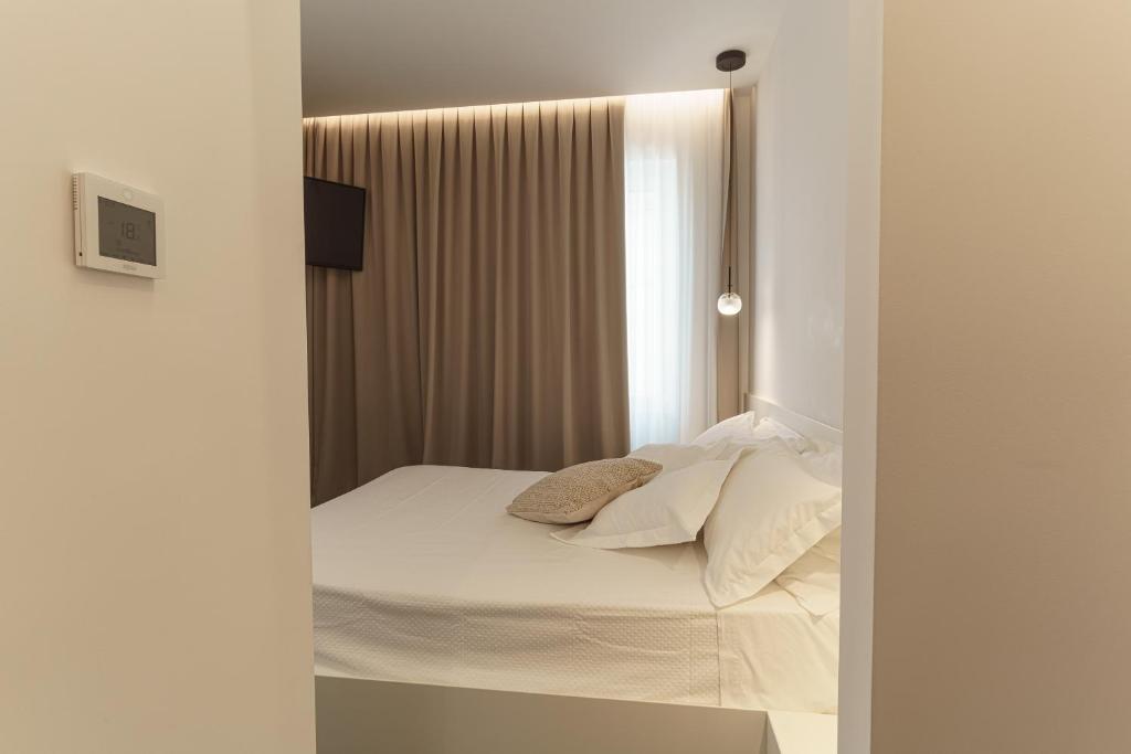 Łóżko lub łóżka w pokoju w obiekcie B&B Nel Blu Dipinto Di Blu