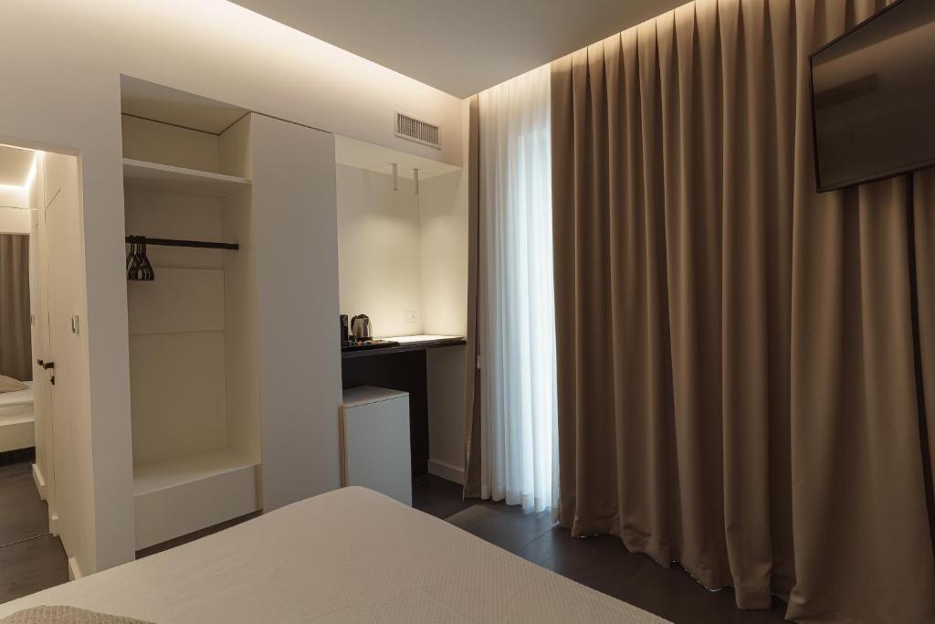 Łóżko lub łóżka w pokoju w obiekcie B&B Nel Blu Dipinto Di Blu