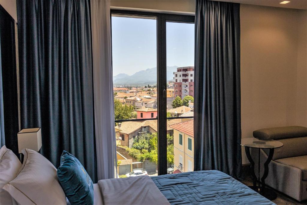 Postel nebo postele na pokoji v ubytování Hotel Golden Palace