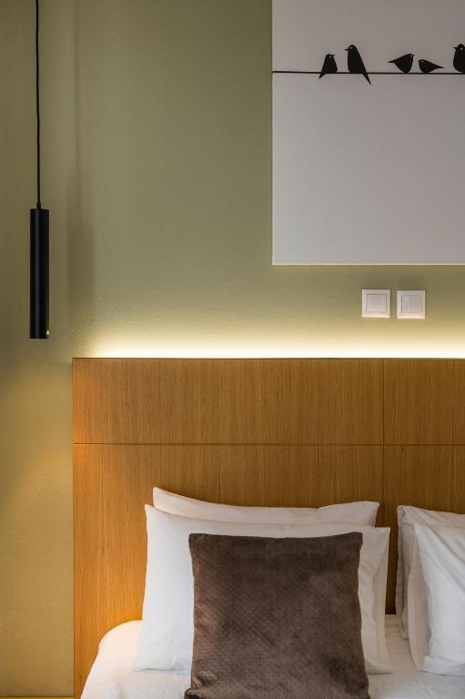 A bed or beds in a room at Nidus Villa